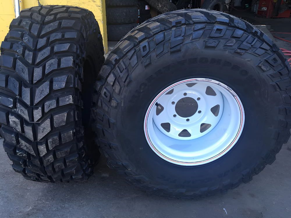 Two Tires Are Sitting Next To Each Other And One Has A White Rim — Goodyear Autocare Bowen in Bowen, QLD