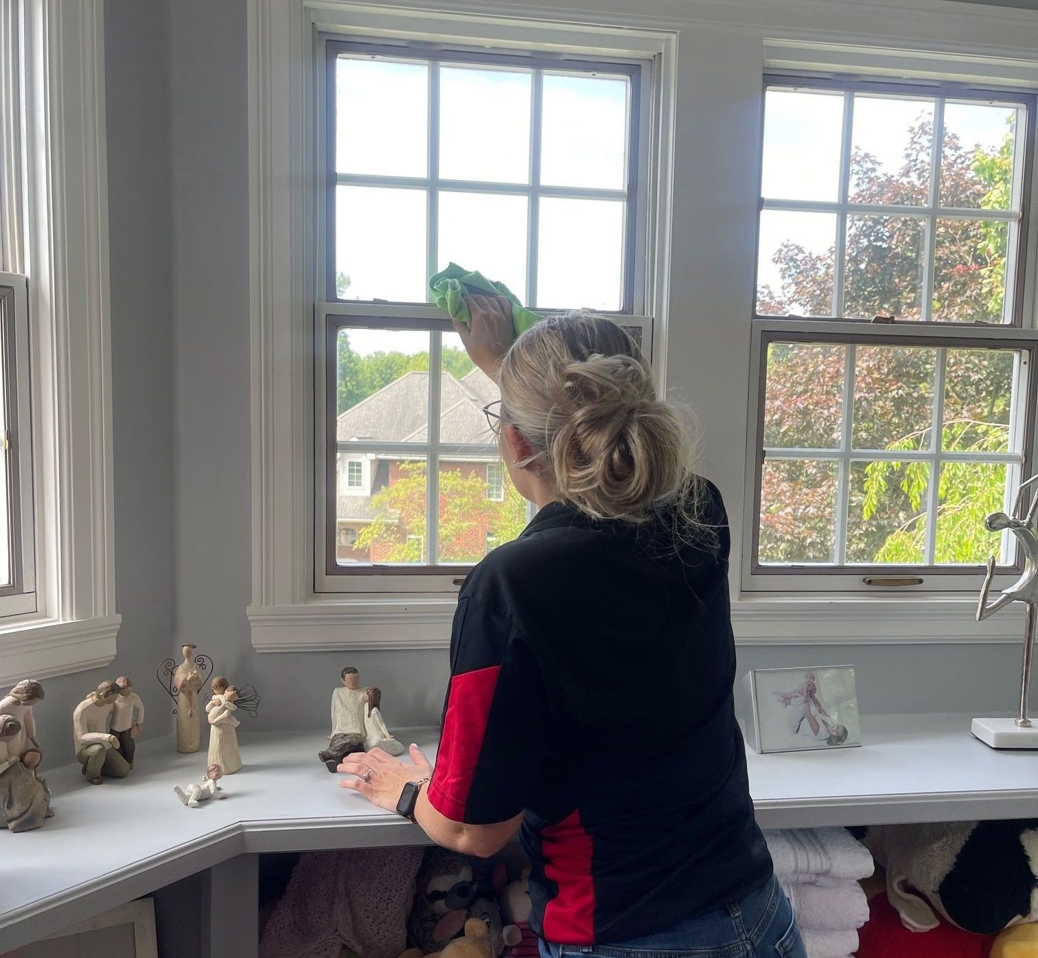 A bedroom with brown walls and a white bed — Erie, PA — Peterson’s Property Maintenance