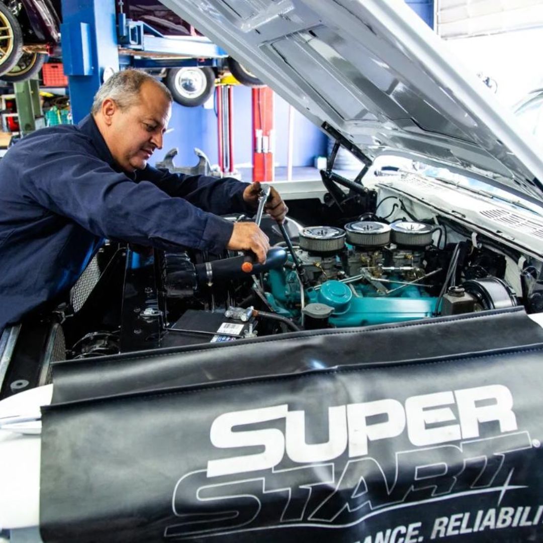 Mechanic Working on a Vehicle Engine | Stevens Creek Muffler & Auto Repair