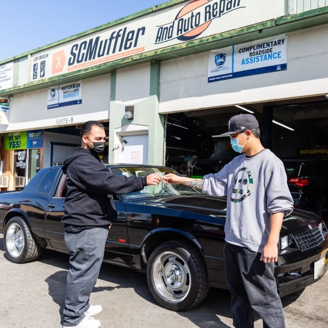 Car Owner Receiving Keys from an Employee | Stevens Creek Muffler & Auto Repair