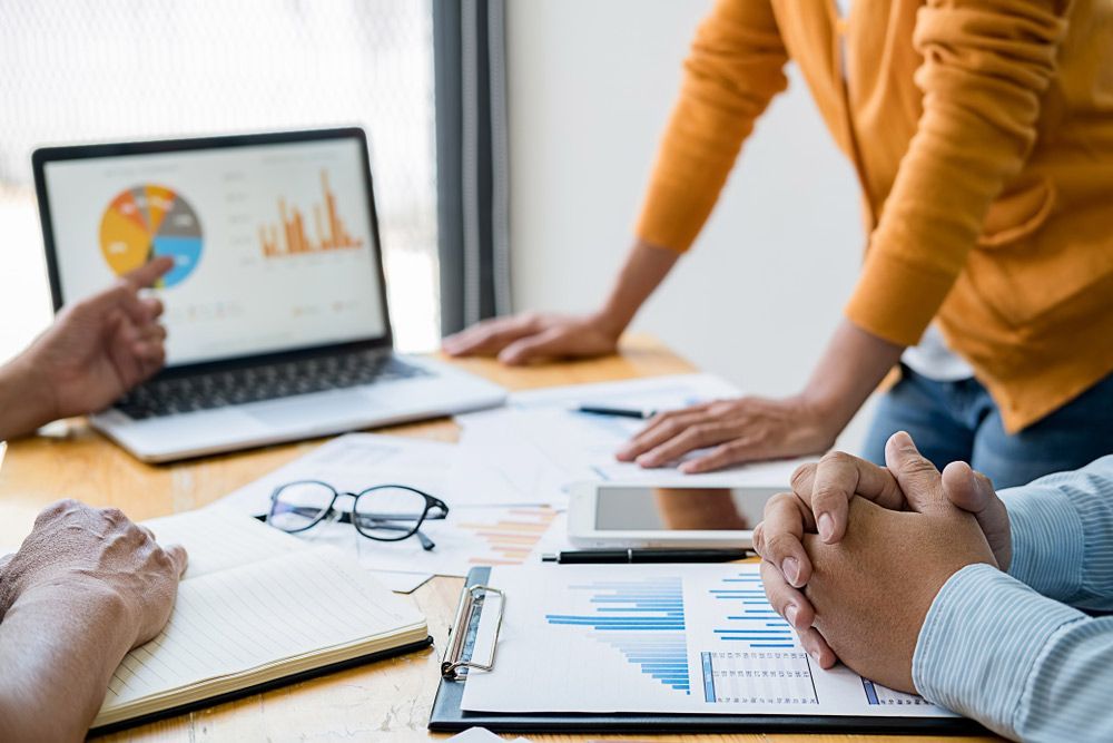 Accounting People Discussing The Charts And Graphs — Whitson Dawson Accountants in North Queensland