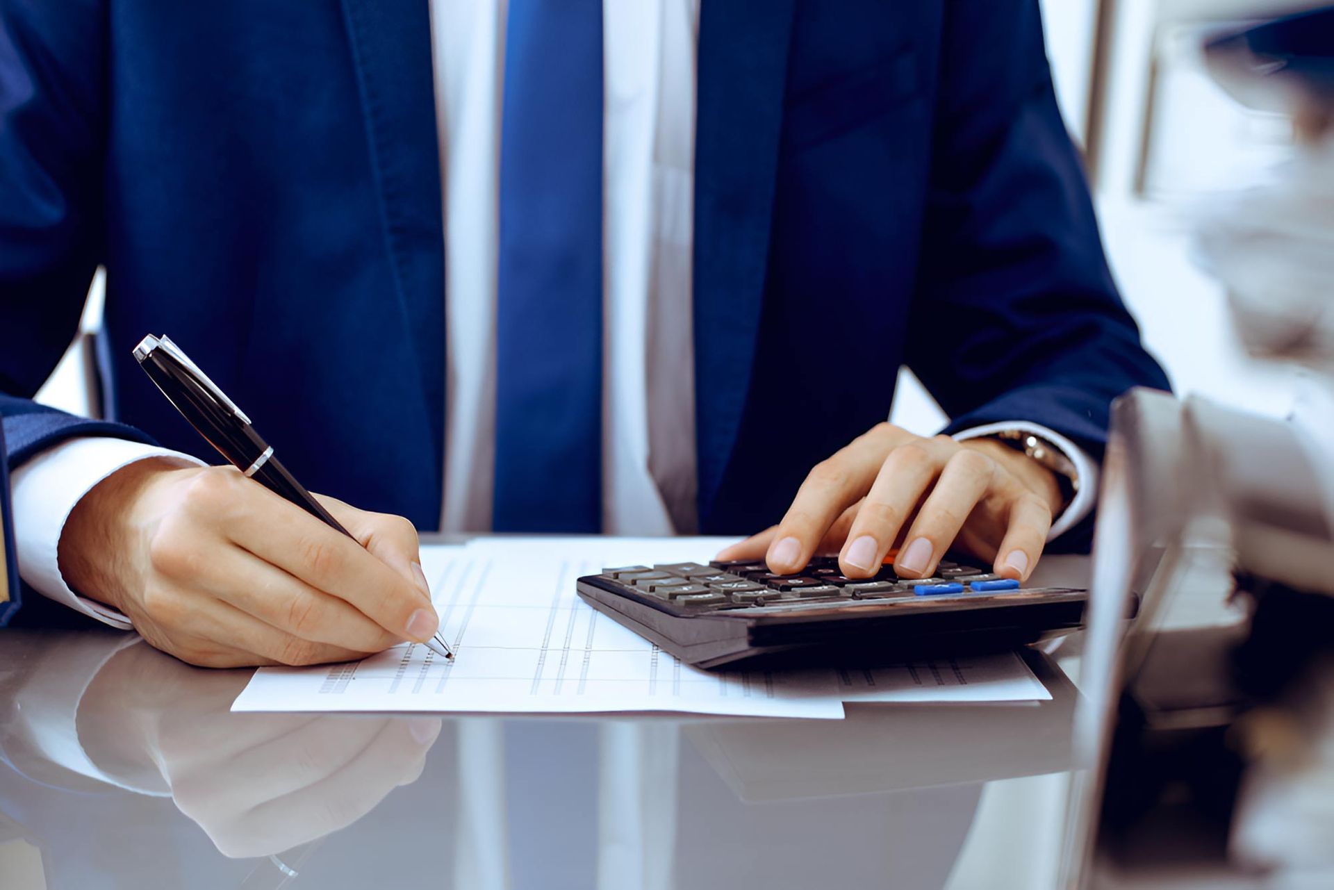 Bookkeeper Checking Financial Document — Whitson Dawson Accountants in North Queensland