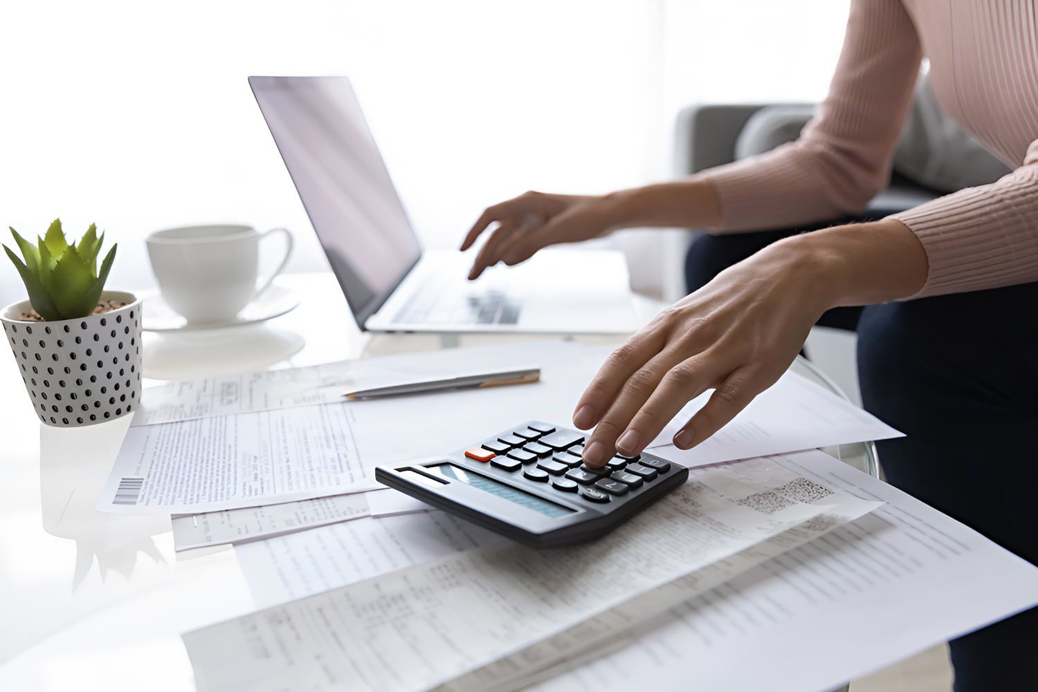 Woman Calculating Monthly Expenses — Whitson Dawson Accountants in Mackay, QLD