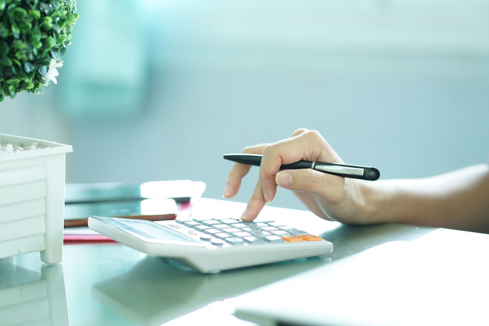 Close Up On Finger Hand Press On Calculator For Computation — Whitson Dawson Accountants in North Queensland