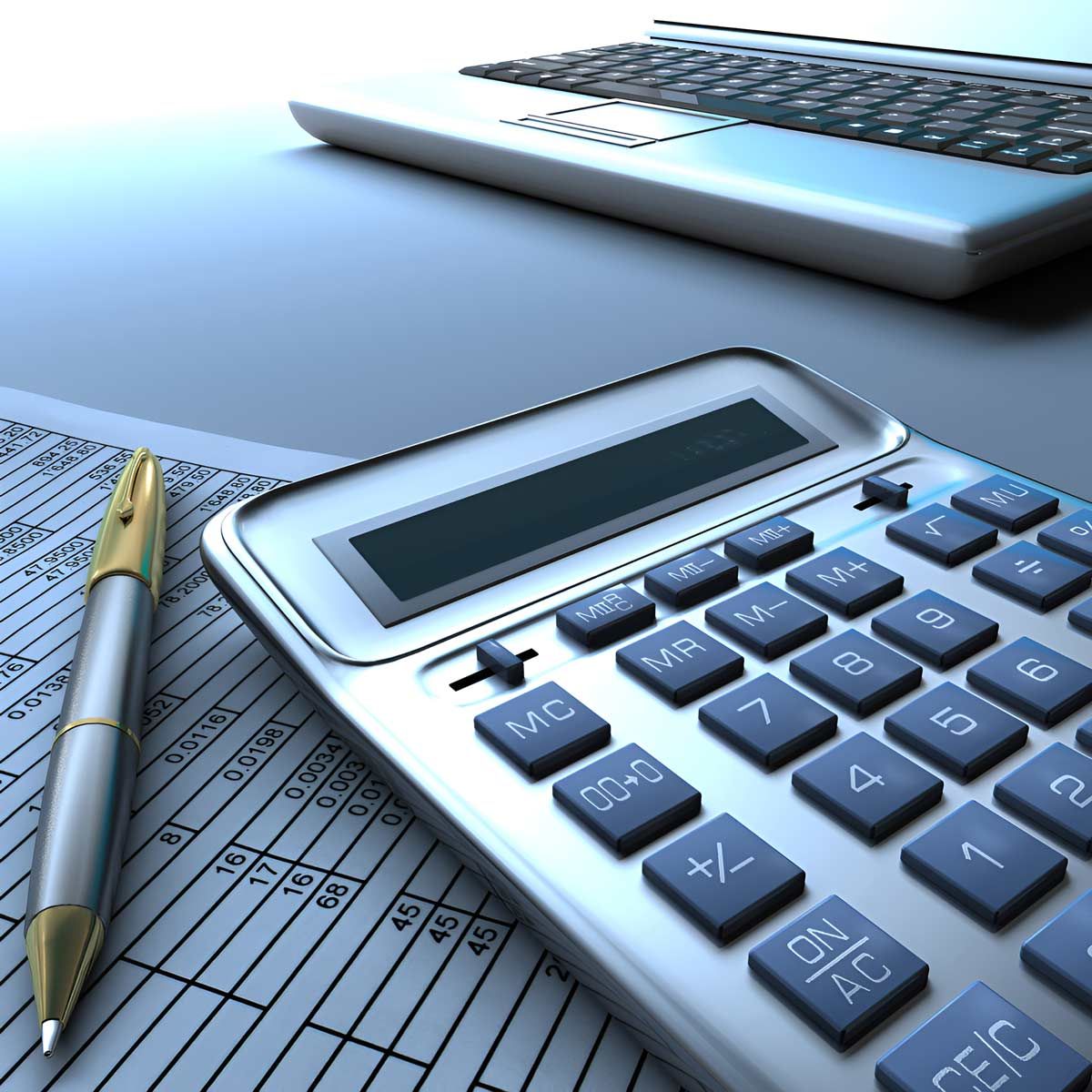 A Calculator Sits On A Table Next To A Pen — Whitson Dawson Accountants in North Whitsundays, Queensland