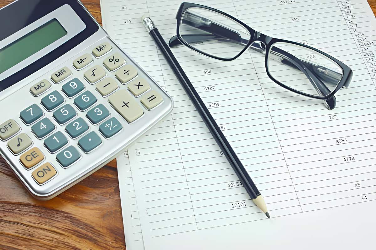 Accounting Concept With Calculator Pencil And Paper — Whitson Dawson Accountants in Mackay, QLD