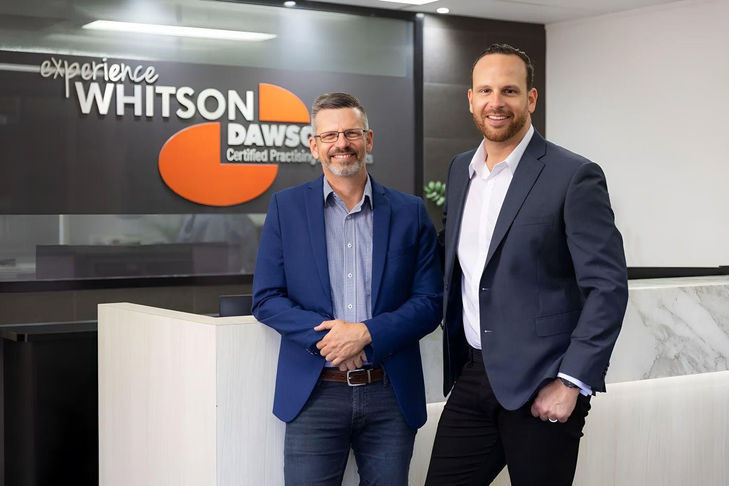 A Group Of Accountant Standing Next To Each Other — Whitson Dawson Accountants in Mackay, QLD
