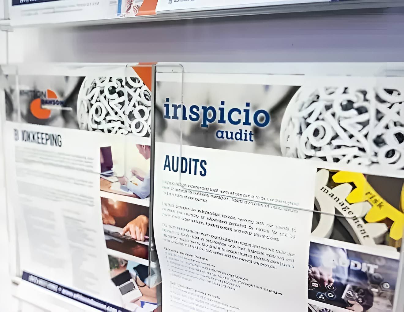 A Bulletin Board With A Page That Says Inspicio Audits On It — Whitson Dawson Accountants in Mackay, QLD