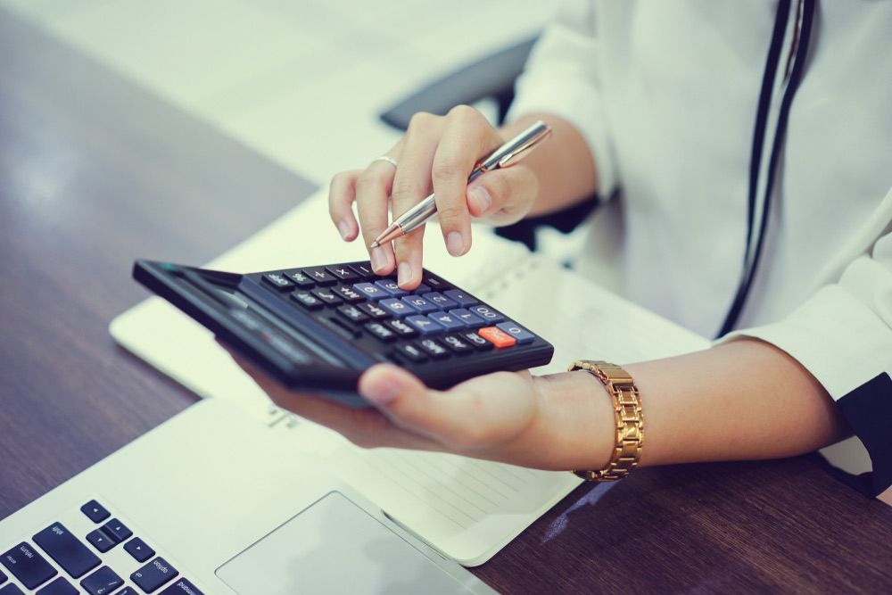 Close Up On Accountant Woman Hand Press On Calculator — Whitson Dawson Accountants in North Whitsundays, Queensland