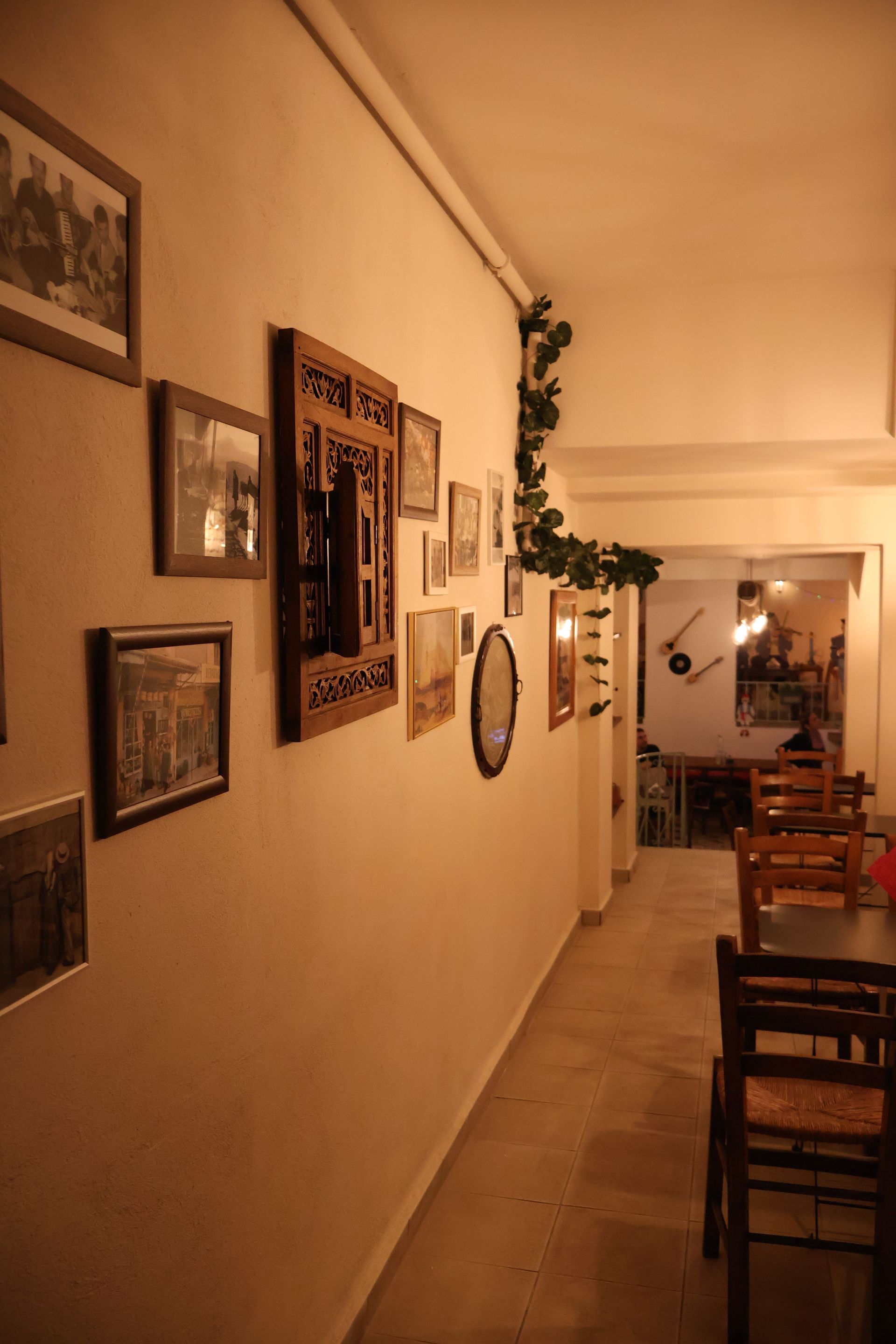 A restaurant with tables and chairs and a staircase