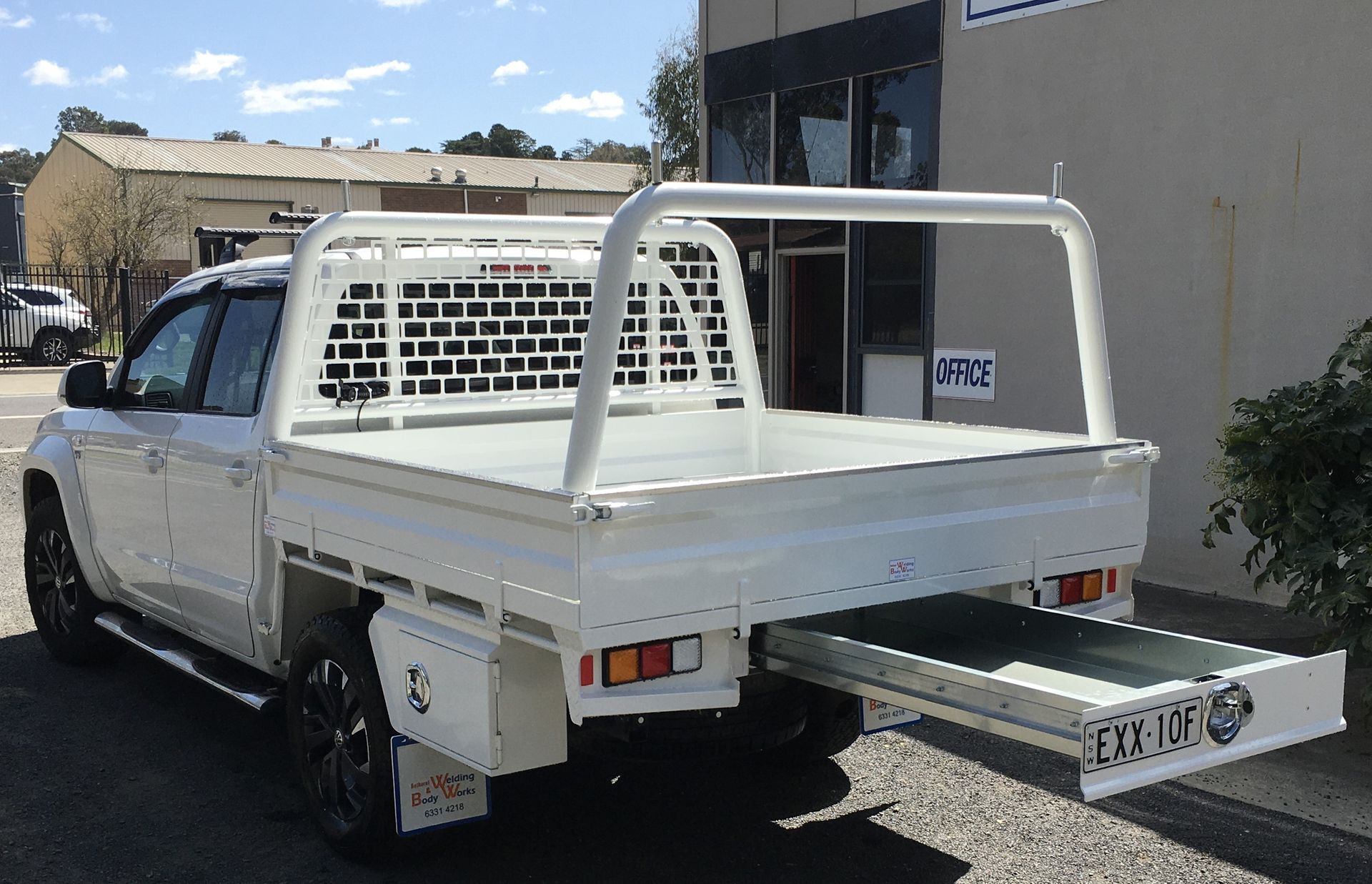A Man Is Welding A Piece Of Metal In A Dark Room — Bathurst Welding & Body Works In Cowra, NSW