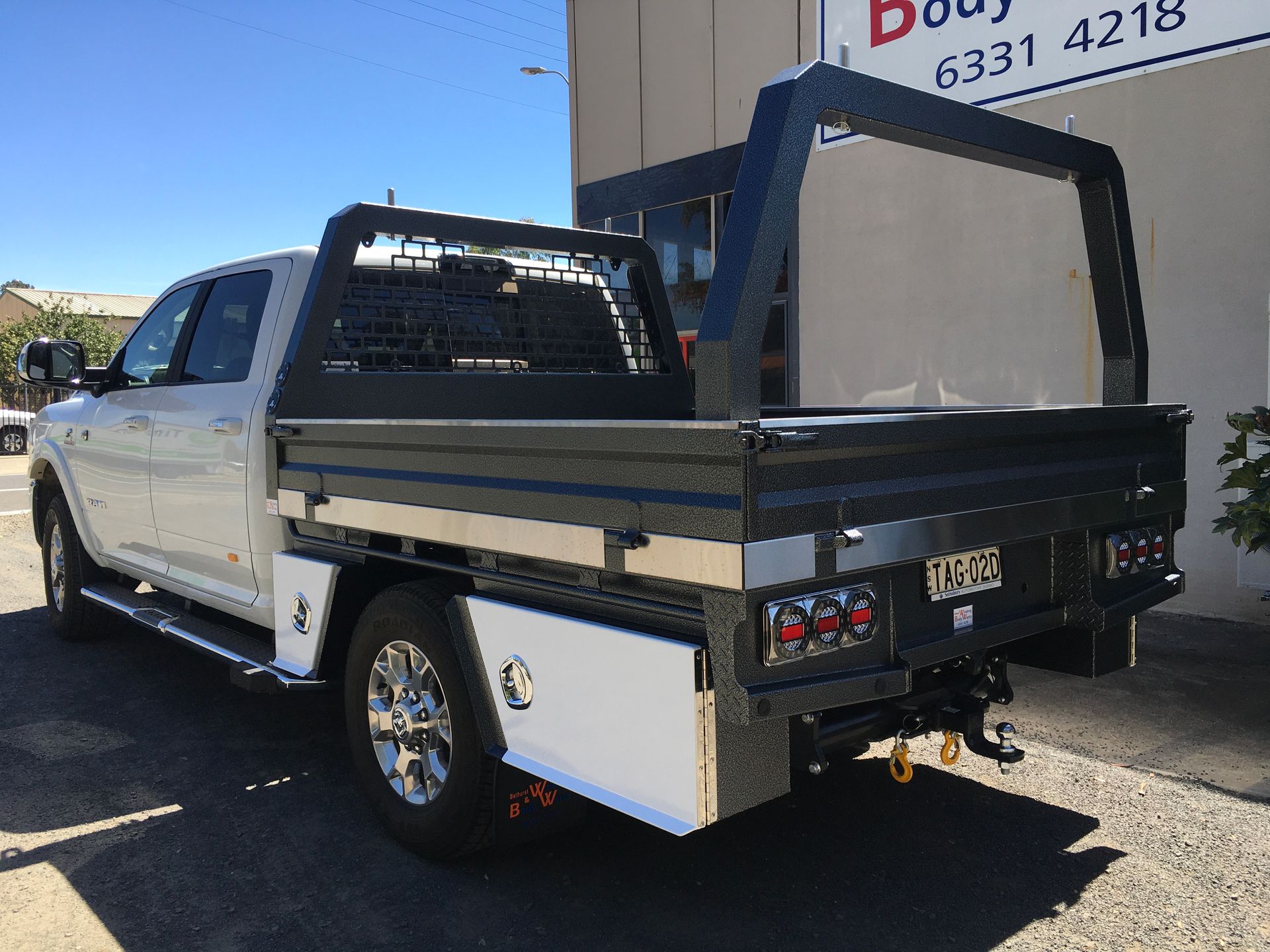 A Man Wearing A Welding Mask Is Welding A Piece Of Metal — Bathurst Welding & Body Works In Bathurst, NSW