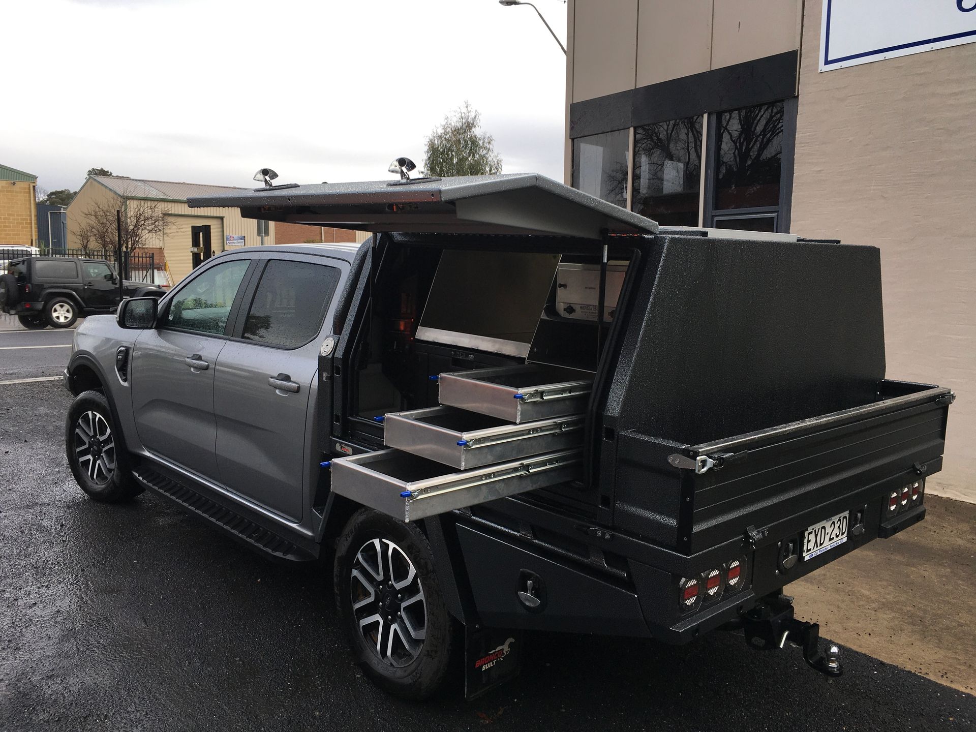 A White Truck With A Canopy full of drawers pulled out— Bathurst Welding & Body Works In Bathurst, NSW