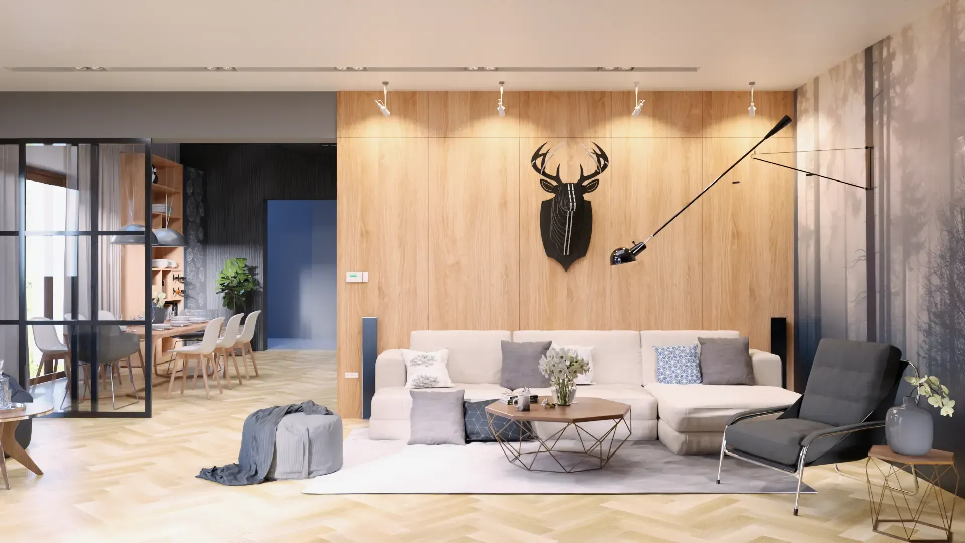 Een woonkamer met een bank, stoel, salontafel en een hertenkop aan de muur.