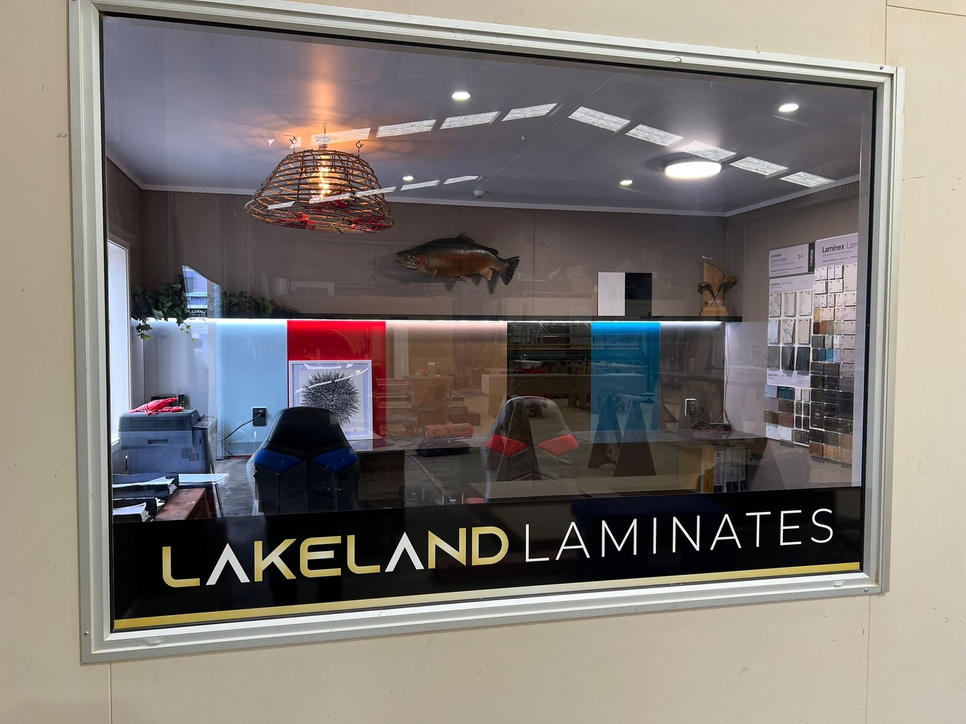 A large window with a sign on it that says lakeland laminates.