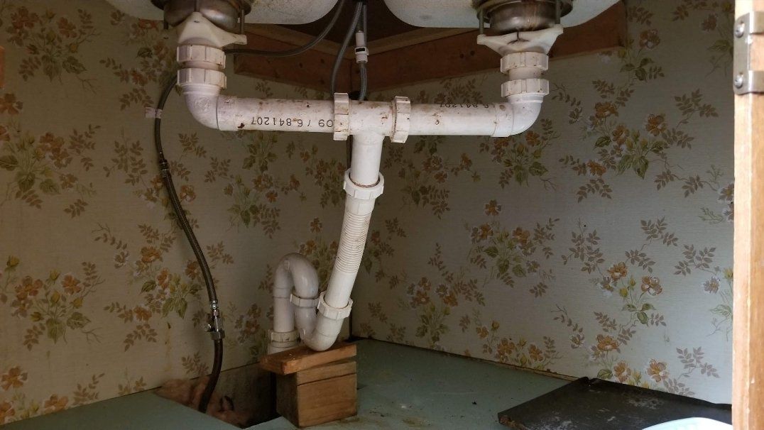 Residential plumbing contractor repairs a pipe in Slippery Rock, PA