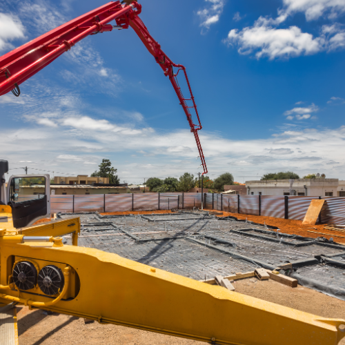 A house is being built with a lot of wires coming out of it.