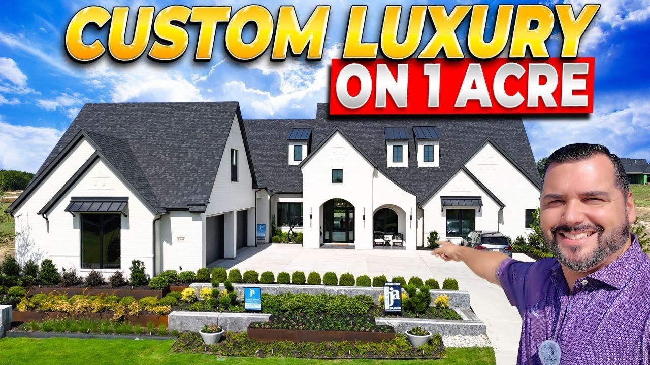 Man pointing to a white, luxury home on a sunny day; text reads 