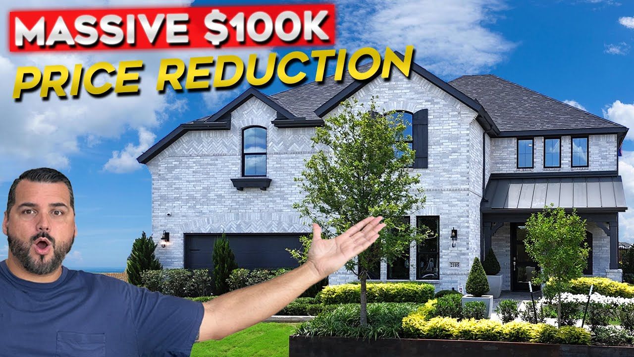 Man gestures toward a house with a $100k price reduction announcement.