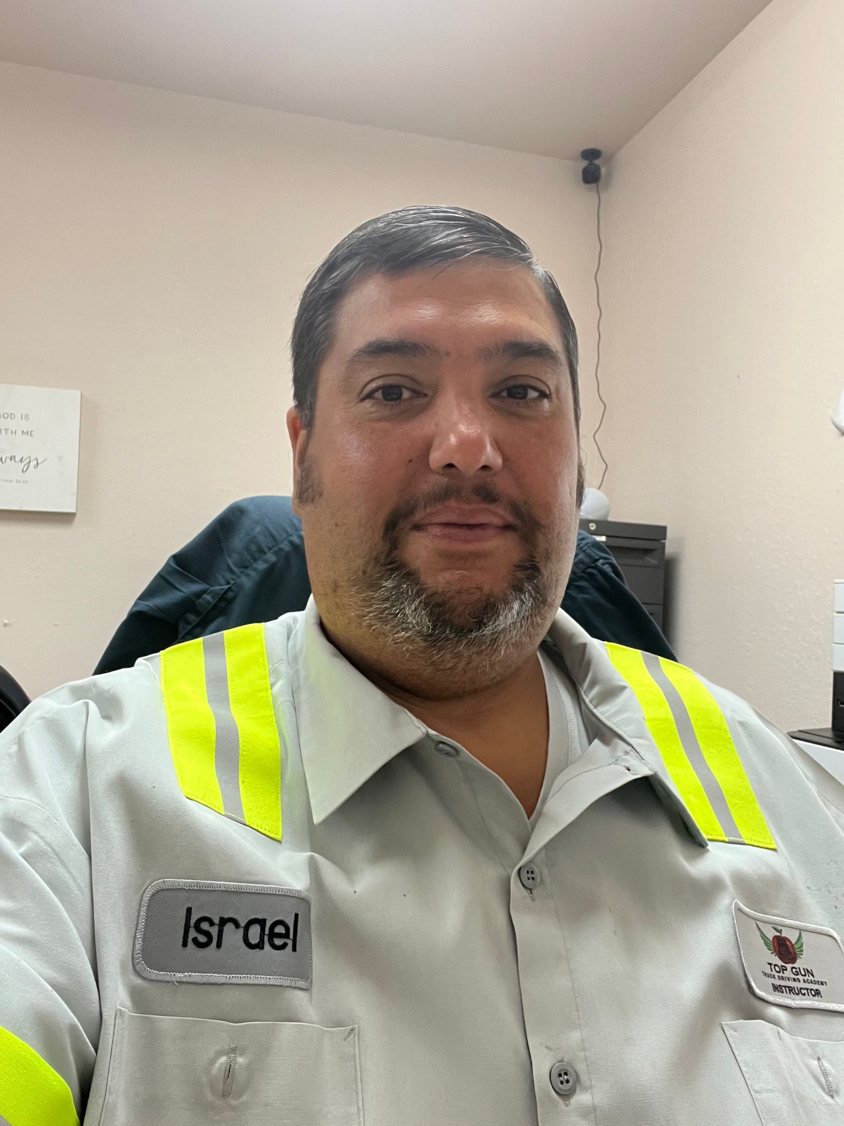 Man in red cap giving thumbs-up, sitting in a truck cab. Sunlight streams in. Man in red cap giving thumbs-up, sitting in a truck cab. Sunlight streams in.