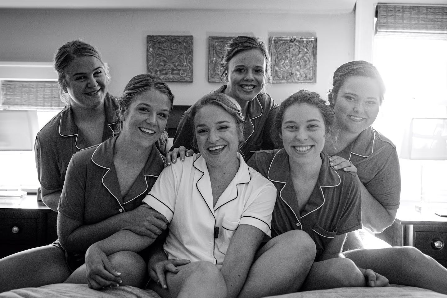 A black and white photo of a bride and her bridesmaids