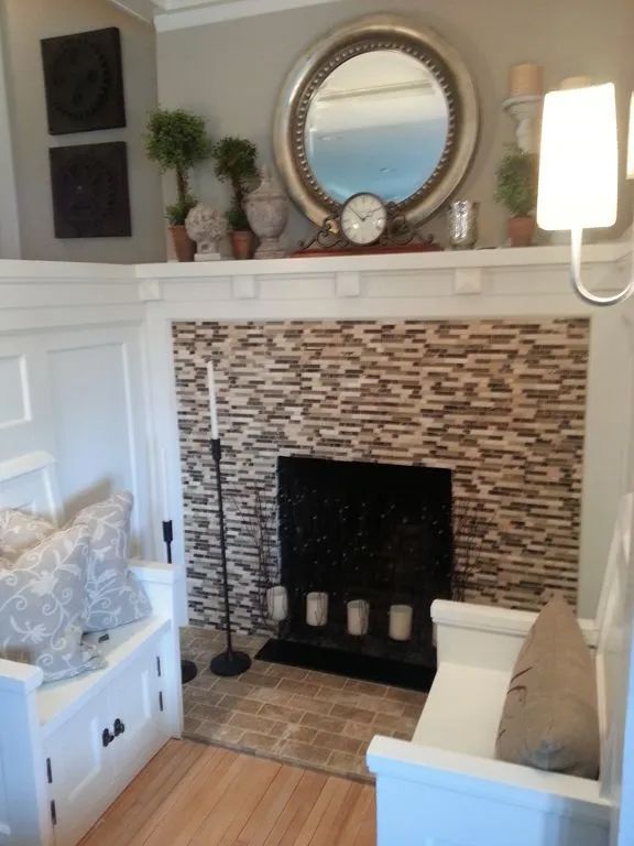 A living room with a stone fireplace