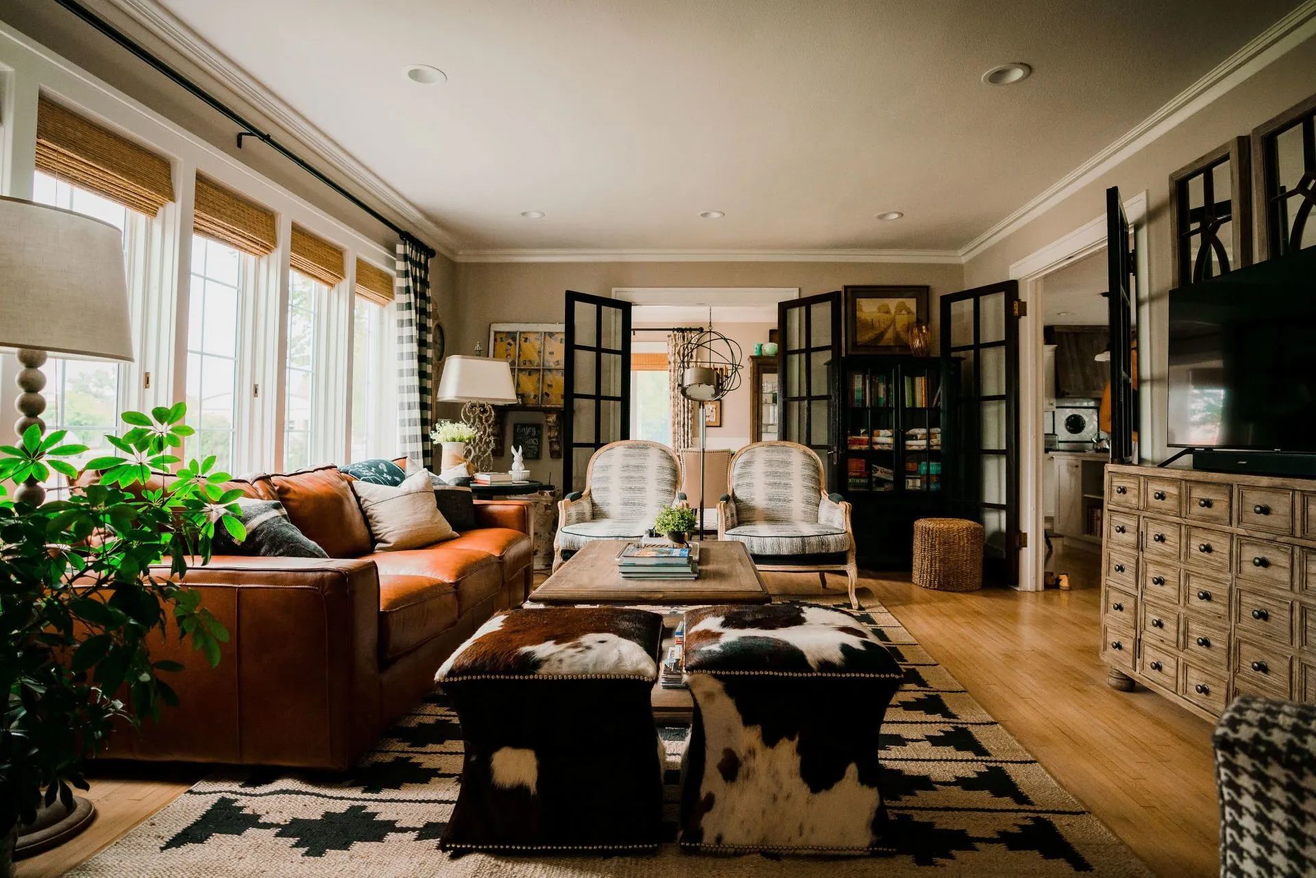 A living room filled with furniture and a rug