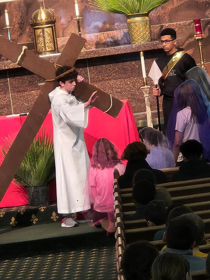 A group of people standing in front of a podium in a church