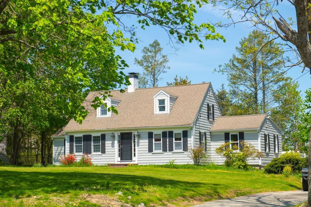 Person wiring coaxial cables inside a wall.