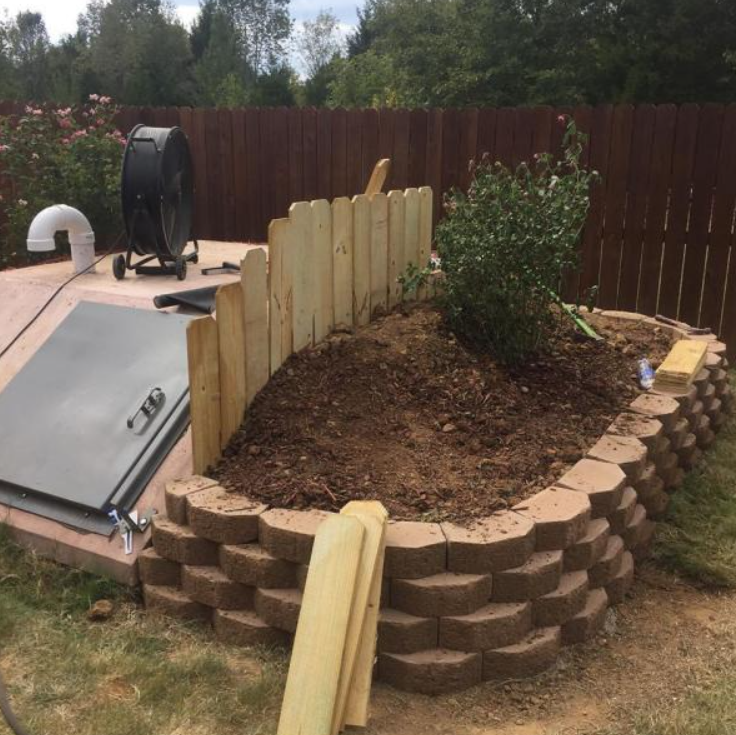 flower bed inside retaining wall