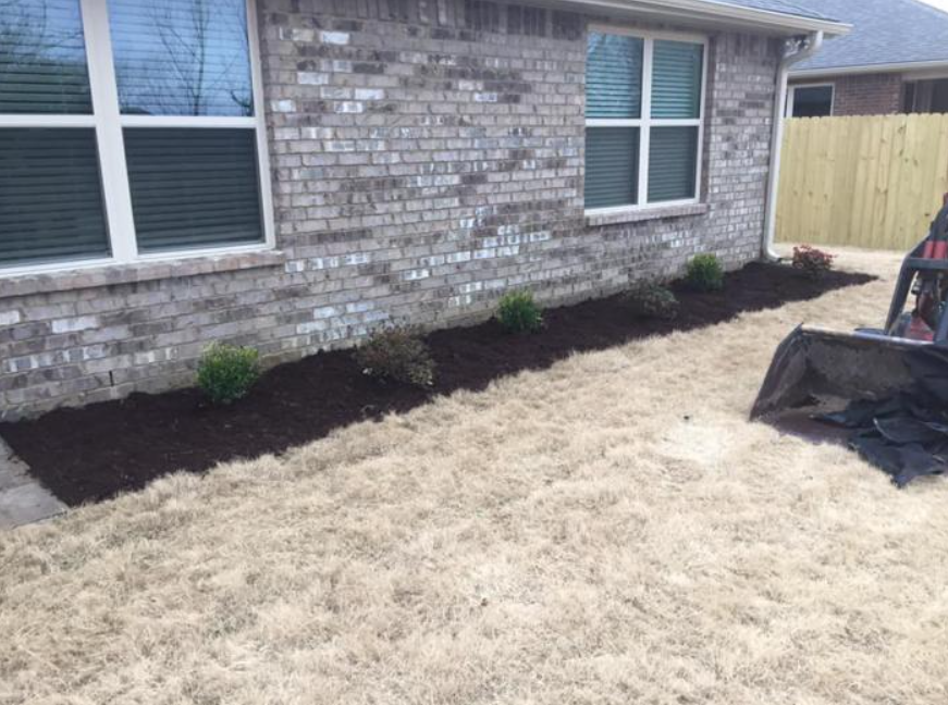 flower bed with brown mulch