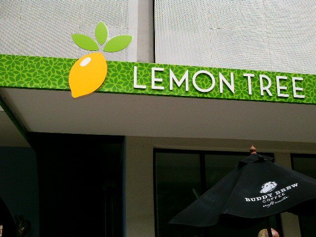 A building with a sign that says lemon tree