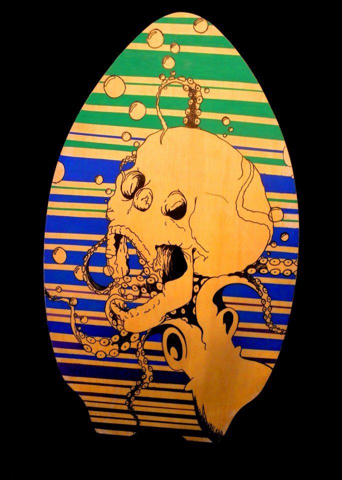 A drawing of a skull and octopus on a black background