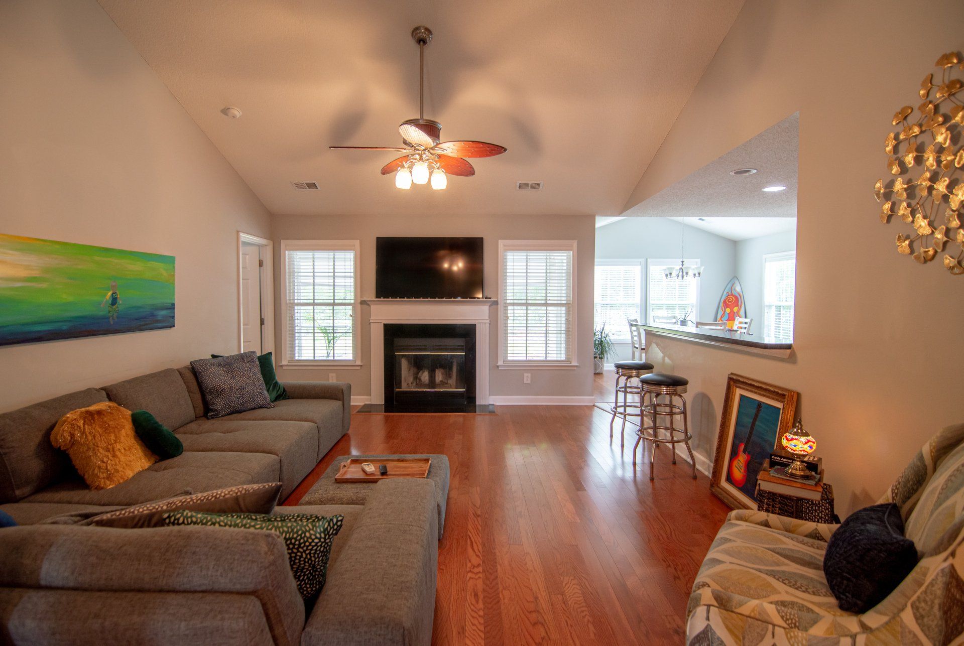 A living room filled with furniture and a fireplace.