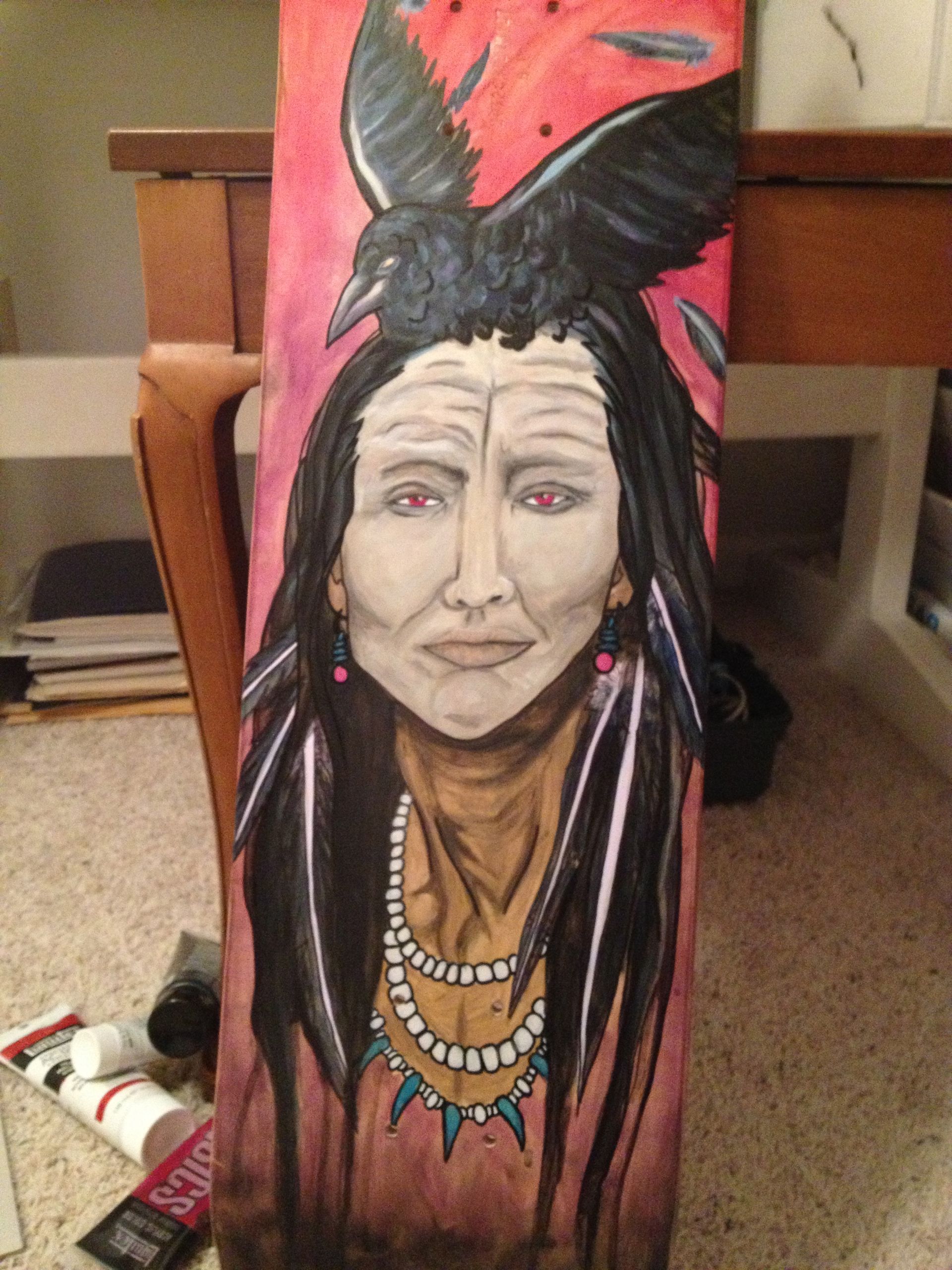 A painting of a native american with a bird on her head