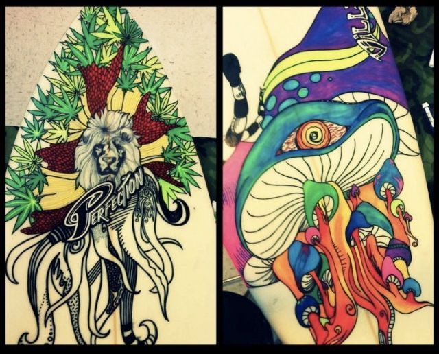 A surfboard with a lion and a mushroom on it