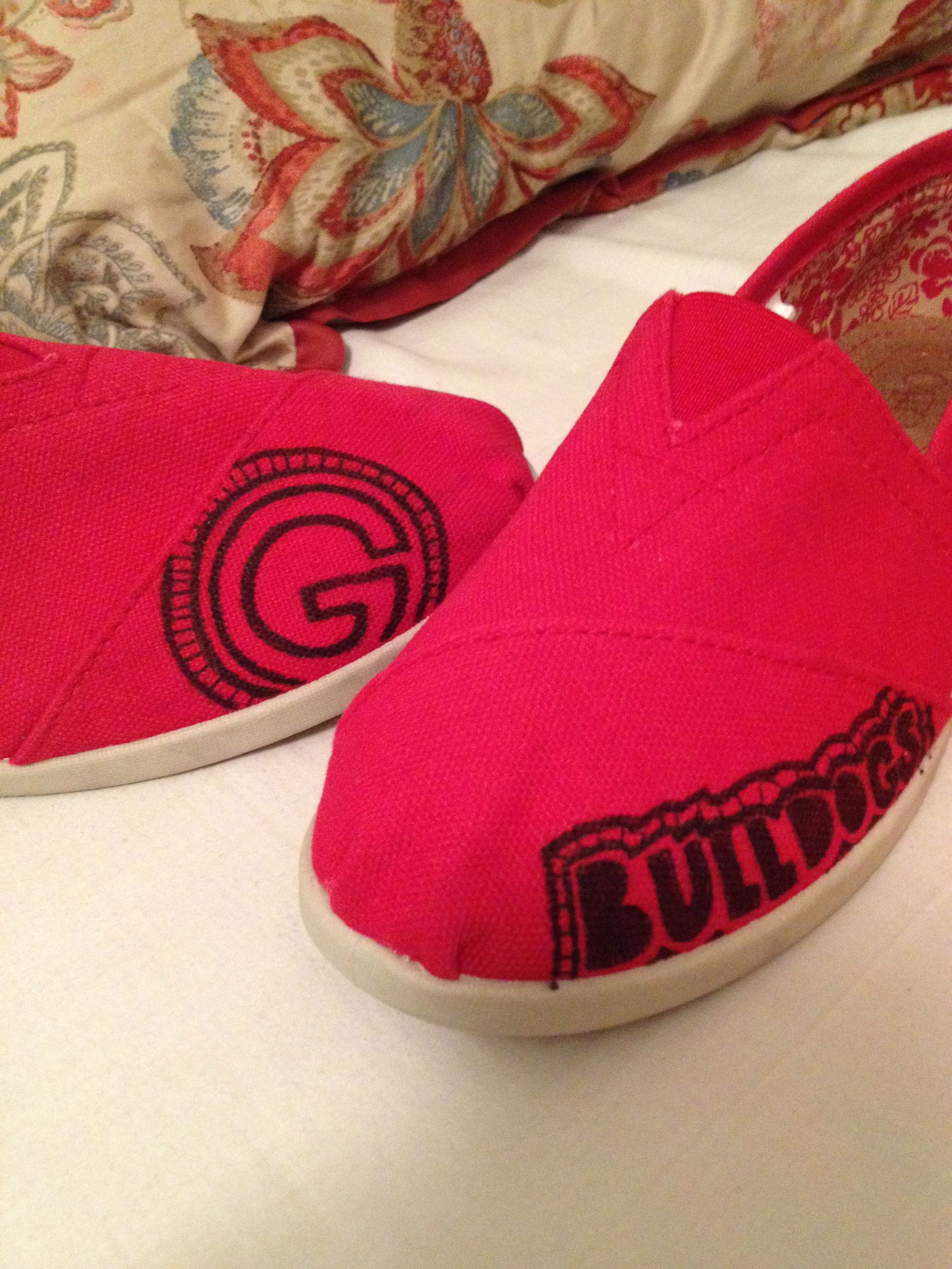 A pair of red shoes with the word bulldog on them