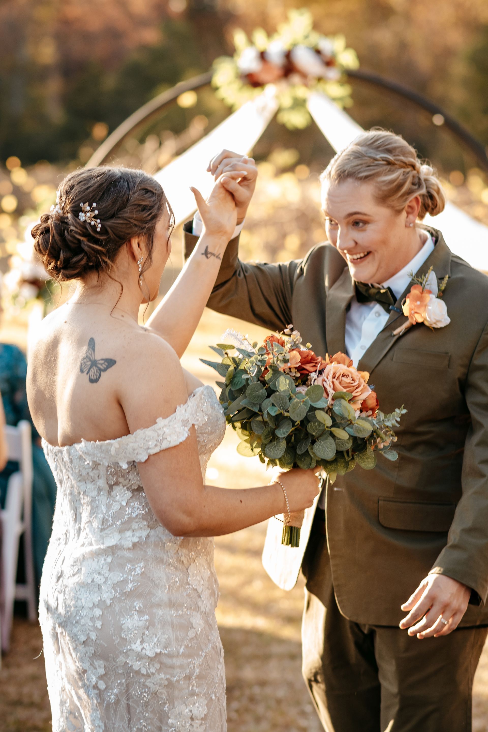 A bride and groom are dancing at their wedding ceremony.