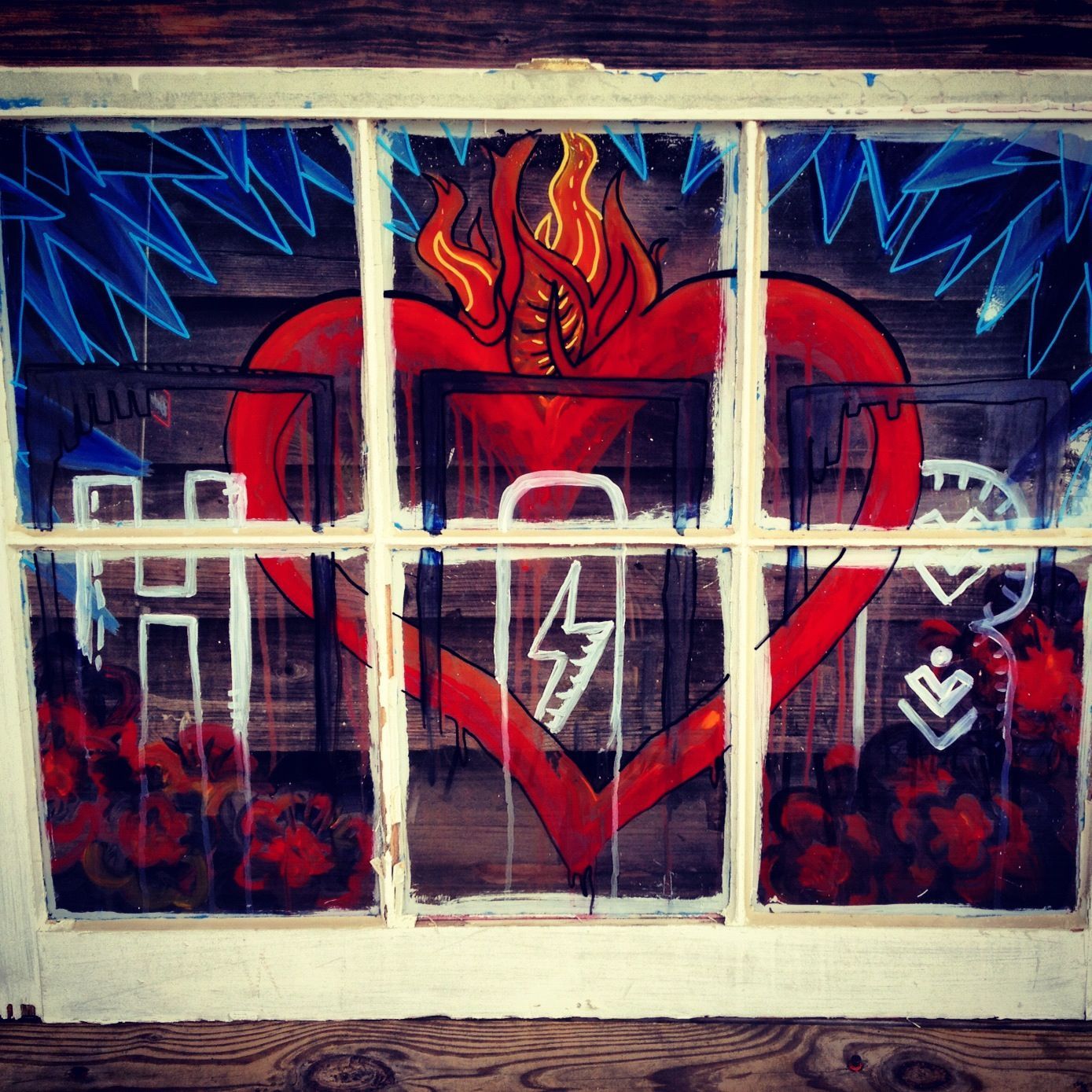 A window with a painting of a heart on it