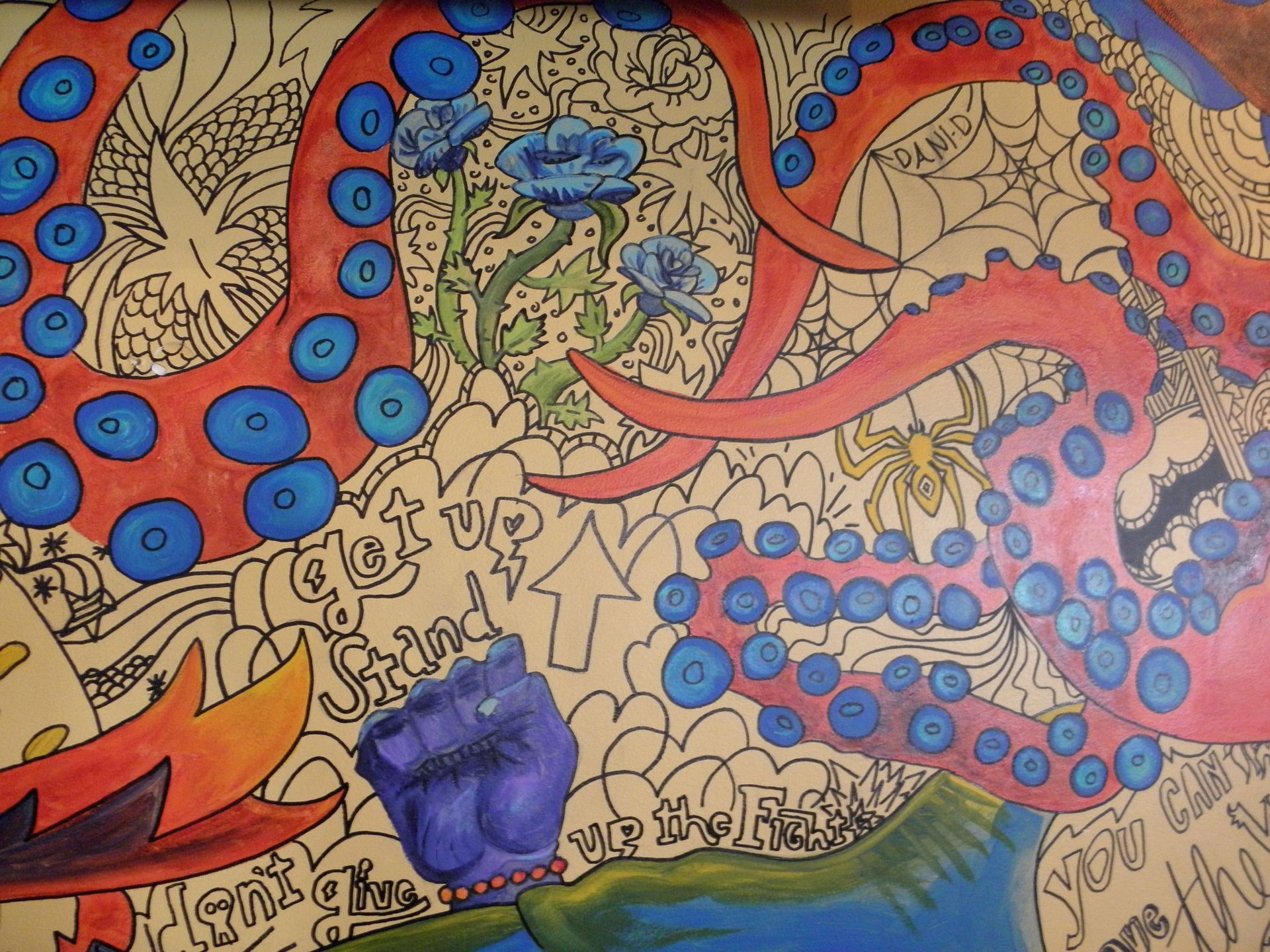 A painting of an octopus with blue circles on it