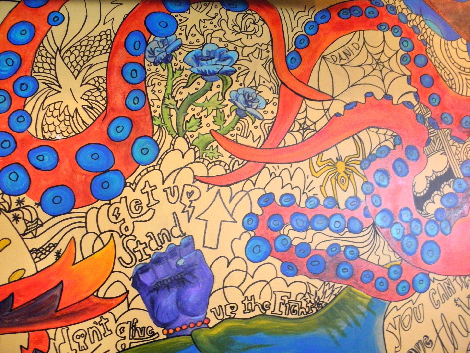 A painting of an octopus with blue circles on it