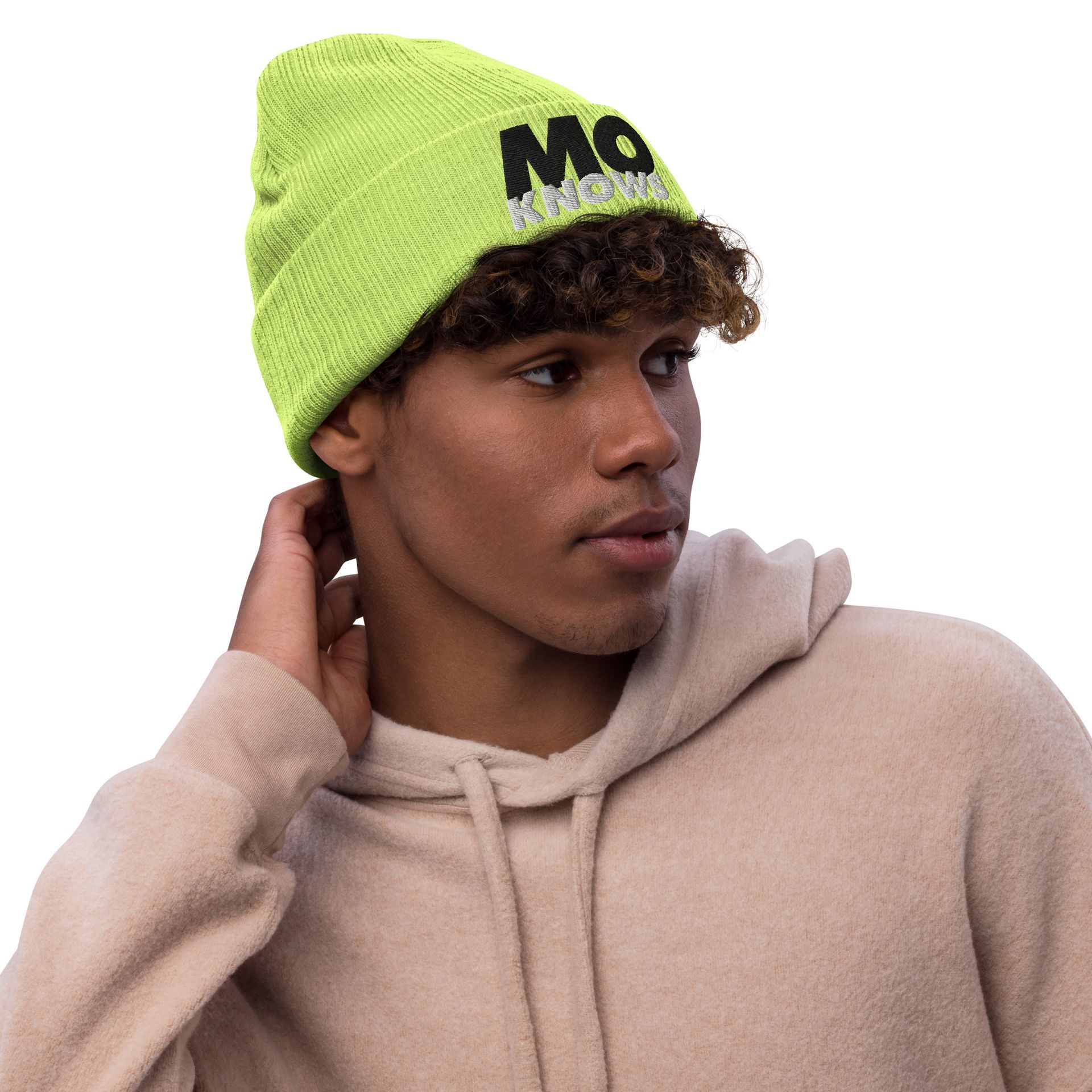 A man wearing a hoodie and a neon green beanie.