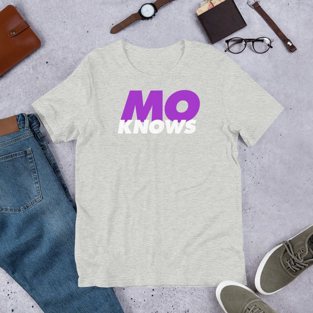 A grey t-shirt with a purple mo knows logo on it