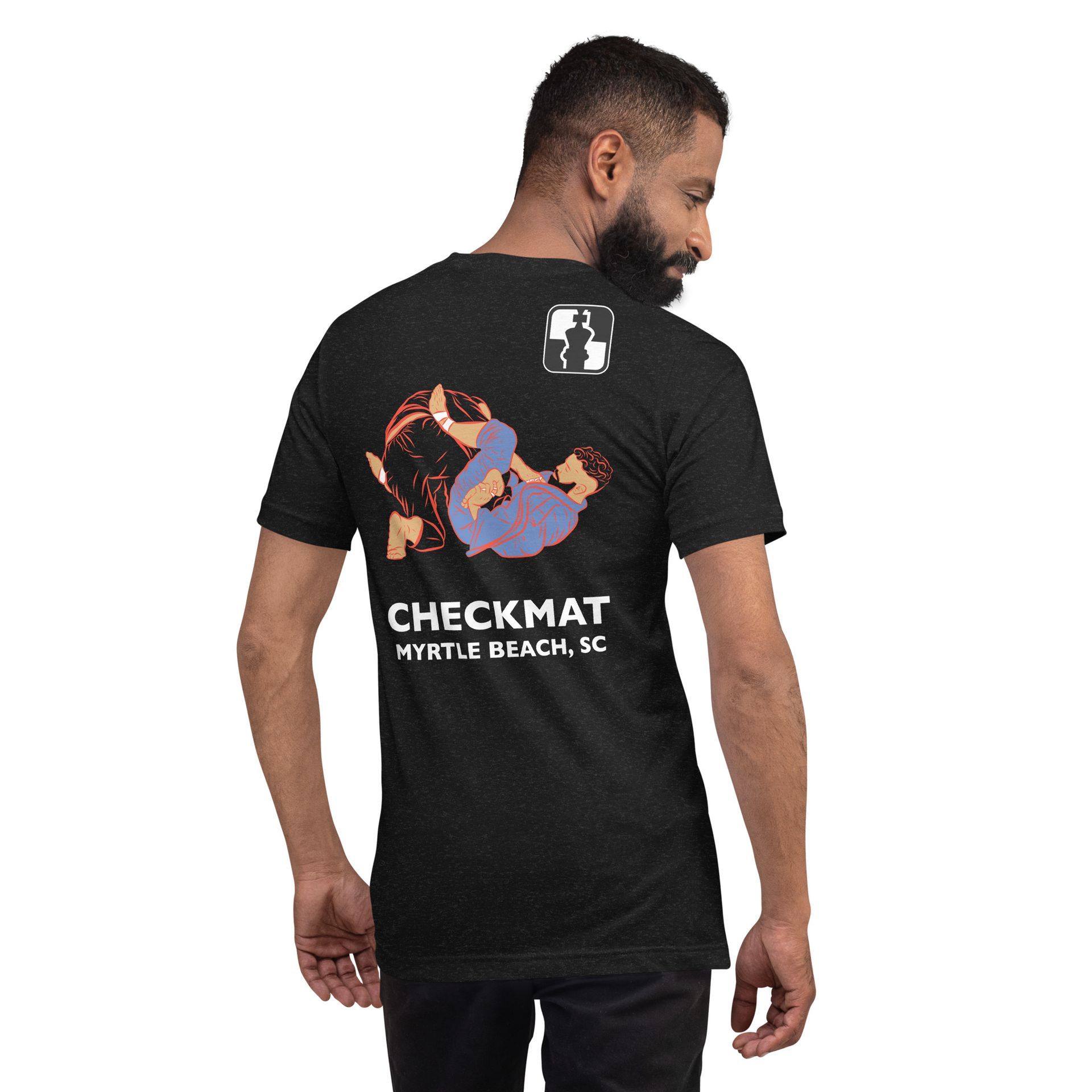 A man is wearing a black t-shirt that says checkmat on the back.