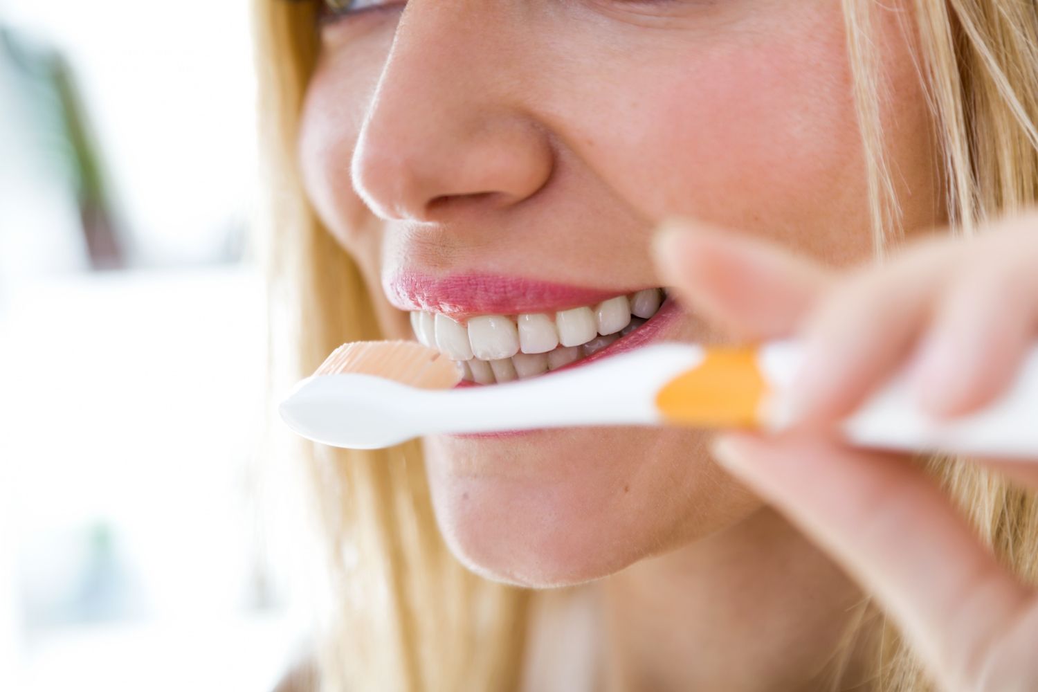 woman brushing teeth