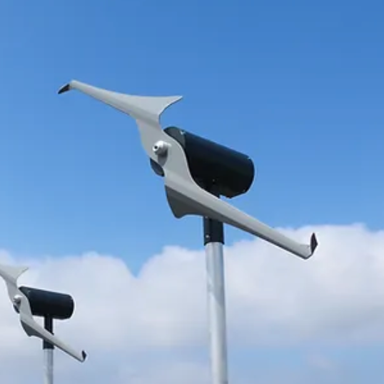 Two wind turbines against a blue sky with clouds