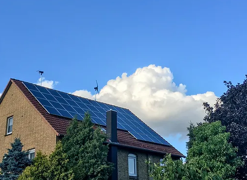 A house with a lot of solar panels on the roof