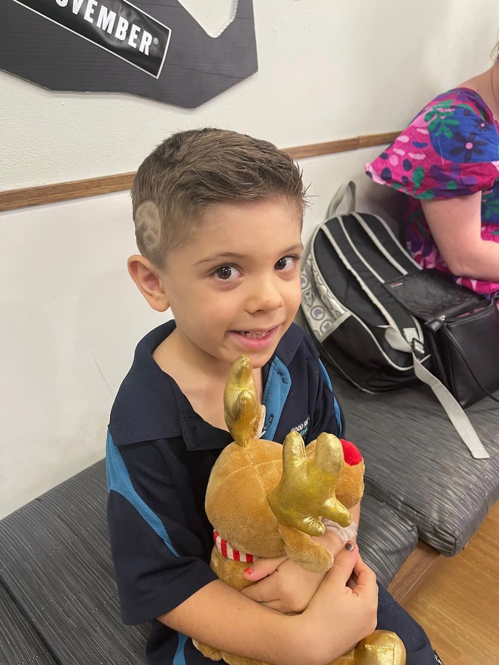 Boy Hugging a Reindeer — Barbers in Darwin, NT