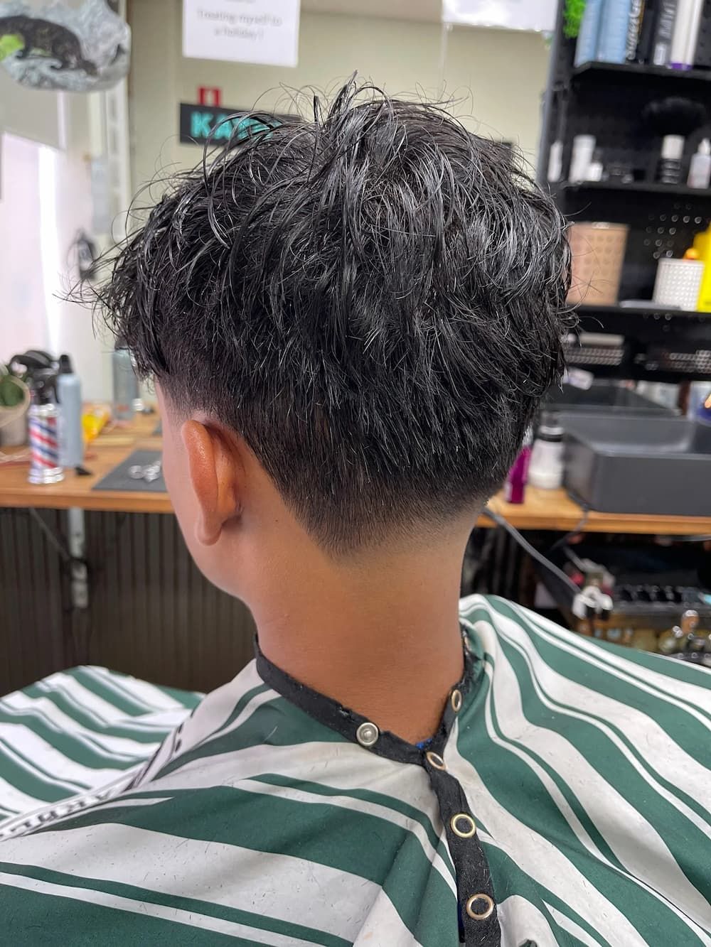 Man Getting a Haircut in Barber Shop — Barbers in Darwin, NT