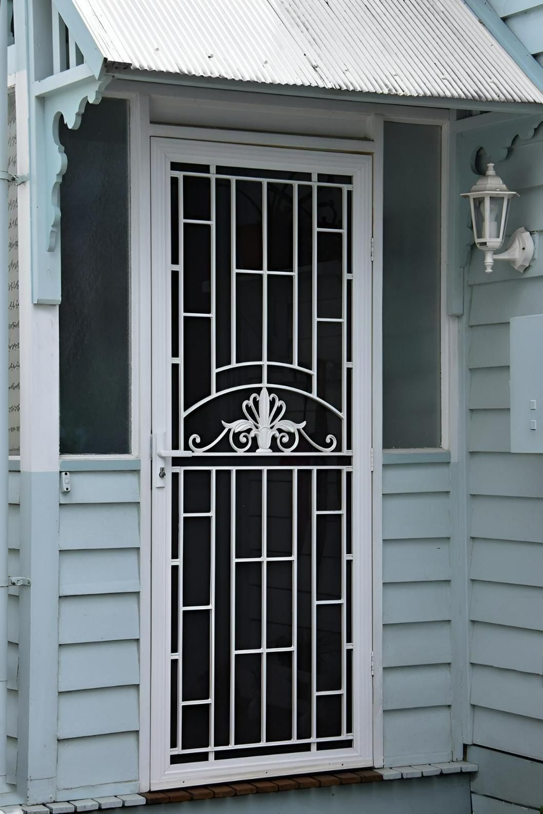 A White Door With a Black Screen on a Blue House — Hunter Valley Lattice in Lake Macquarie, NSW